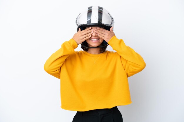 Woman with a motorcycle helmet covering eyes by hands