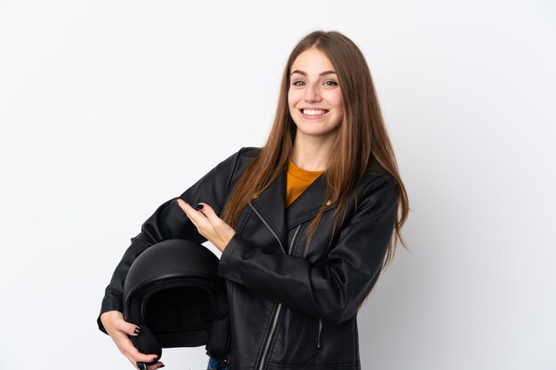 woman with a motorcycle helmet over isolated wall