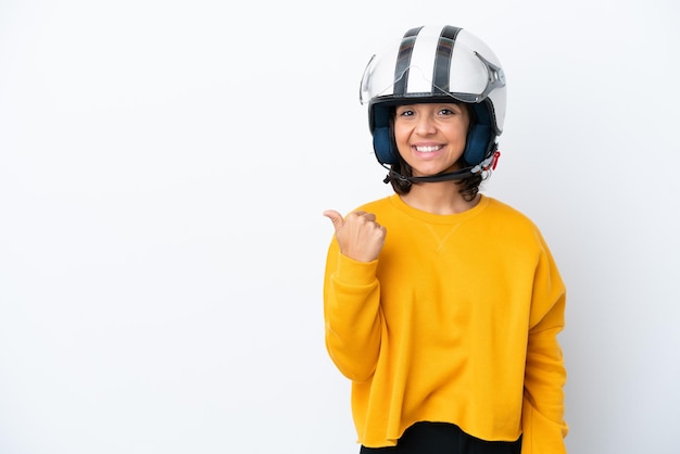 Woman with a motorcycle helmet pointing to the side to present a product