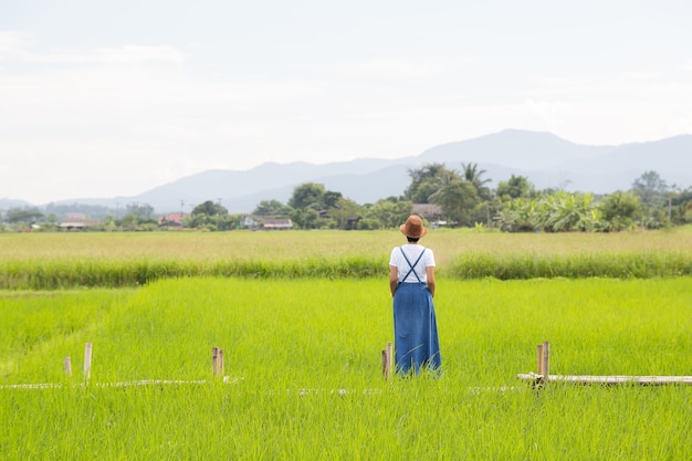 Woman with nature and green field