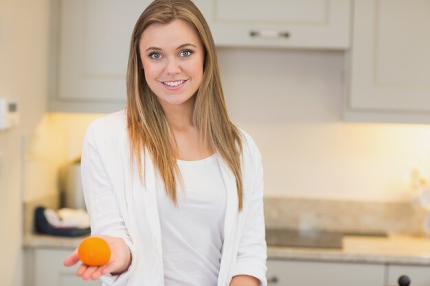 Woman with orange in her hand