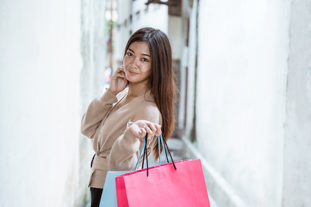 Woman with paper bags enjoyinging shopping