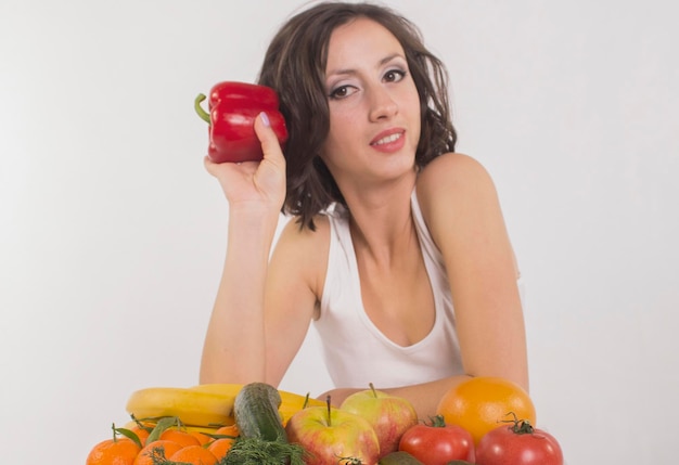 Woman with pepper and fruits