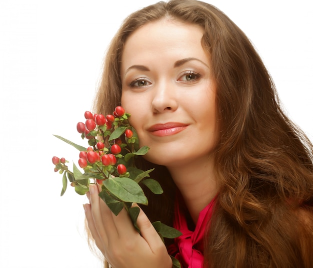 ピンクの花を持つ女性