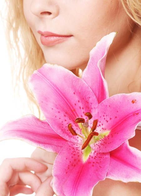 Woman with pink lily highkey portrait