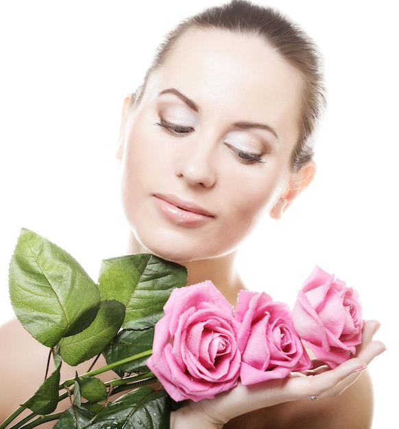 Woman with pink roses close up