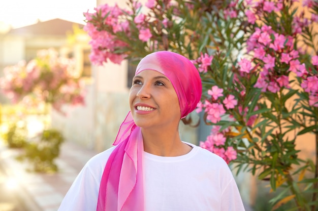 Woman with pink scarf on the head