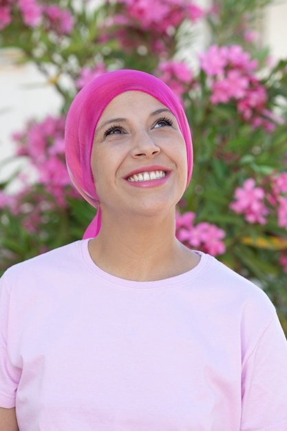 Woman with pink scarf on the head