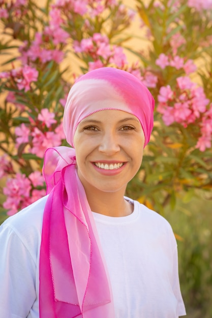 Woman with pink scarf on the head