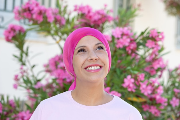 Woman with pink scarf on the head