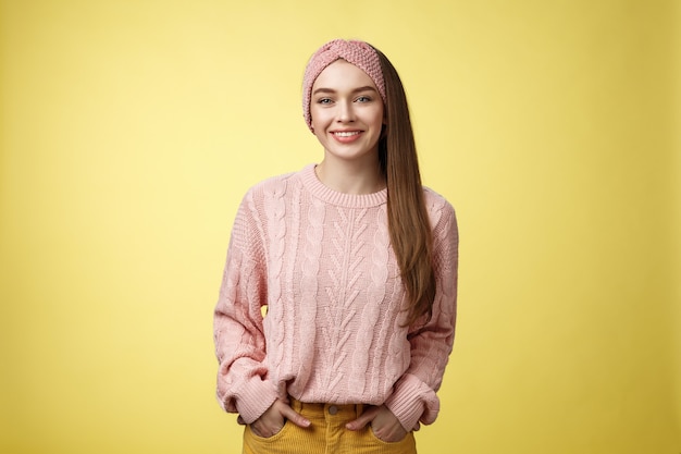 Woman with pink sweater over yellow