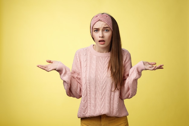 Woman with pink sweater over yellow