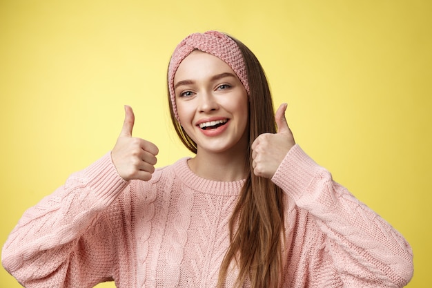 Woman with a pink sweater over yellow