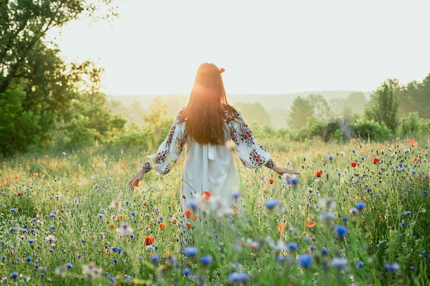 Woman with poppy in hair scenic photography