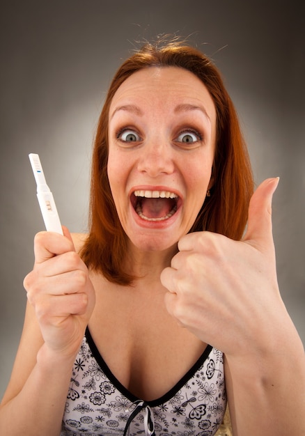 Woman with pregnancy test