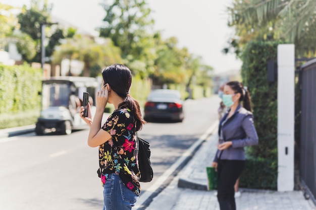 Photo woman with protective mask video call real estate agent.