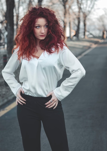 Woman with red hair outdoors