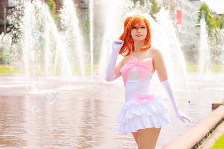 Photo woman with redhead wearing dress against fountain
