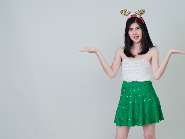 Woman with reindeer headband in christmas day.