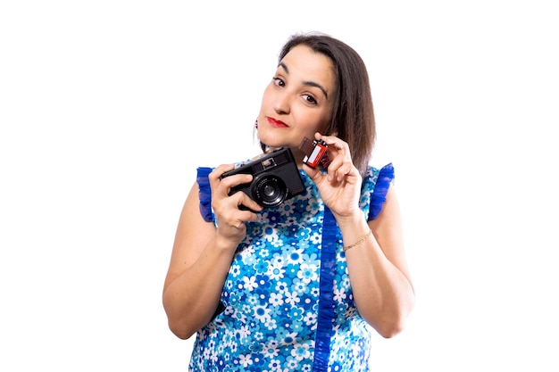 Woman With Retro Camera In Studio