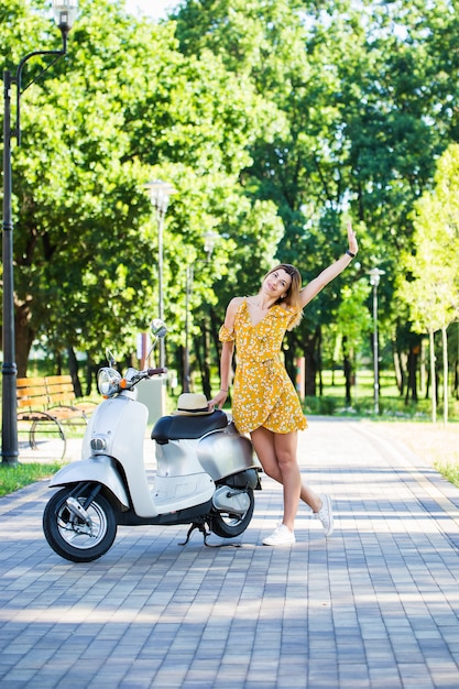 woman with a retro scooter