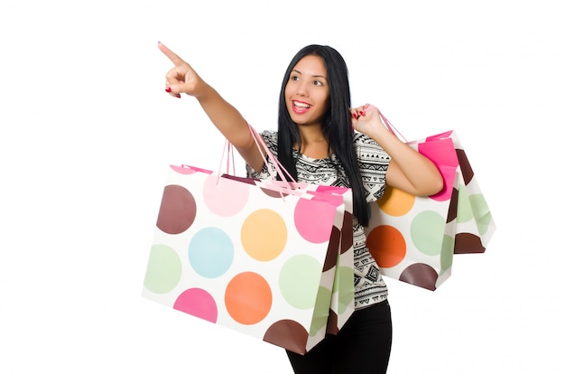 Woman with shopping bags isolated on white