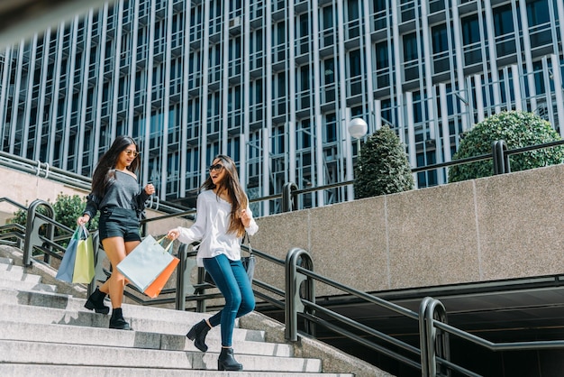 Woman with shopping bags on street