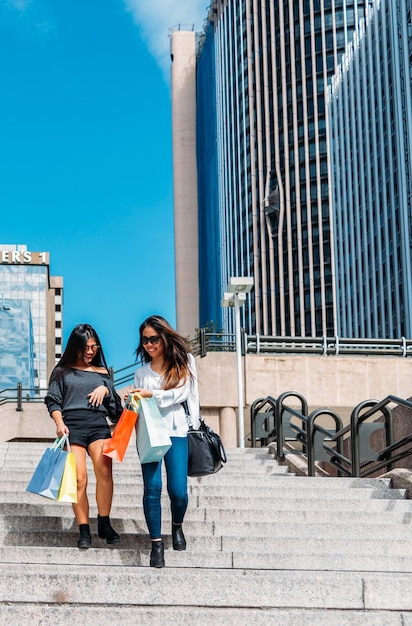 Woman with shopping bags on street