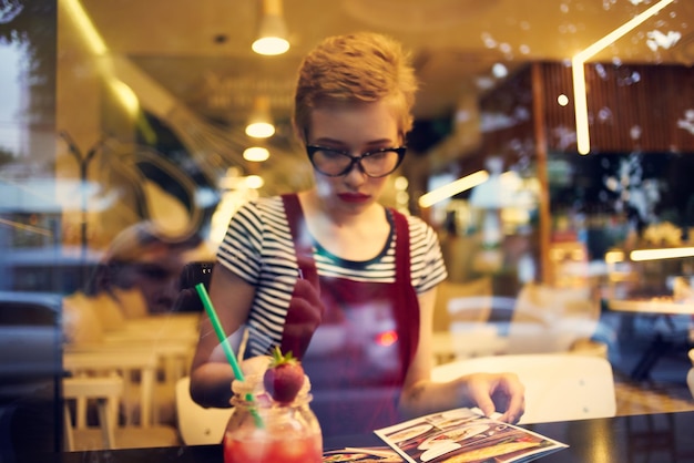 Woman with short hair and cocktail restaurant leisure loneliness