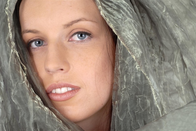 Woman with silk veil closeup