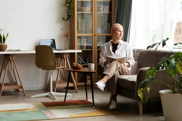 Photo woman with skin cancer spending time at home