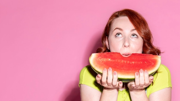 Woman with a slice of watermelon