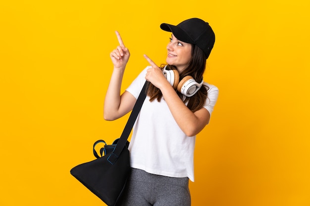 Woman with sport bag in studio