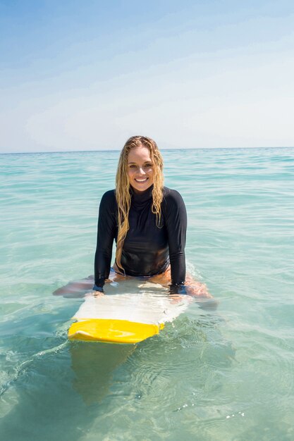 woman with a surfboard on a sunny day