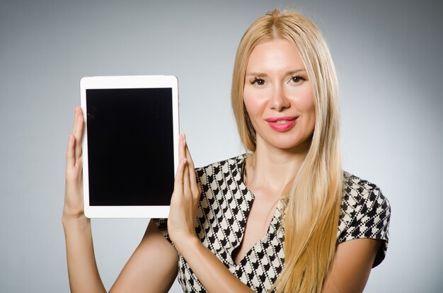 Woman with tablet computer in business concept