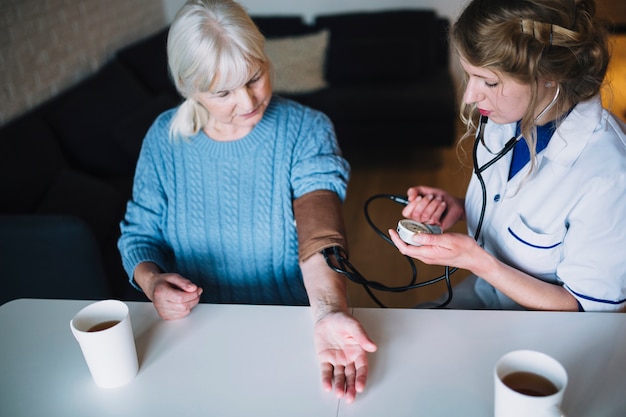 Woman with tea in nursing home