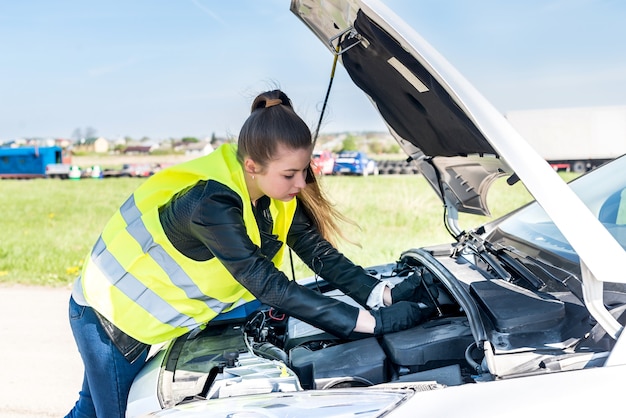 Woman with tester going to check voltage