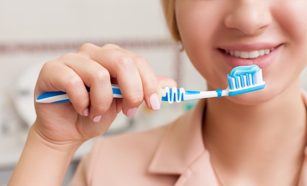 Woman with tooth brush