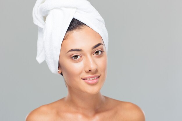 Woman with towel on head looking at camera