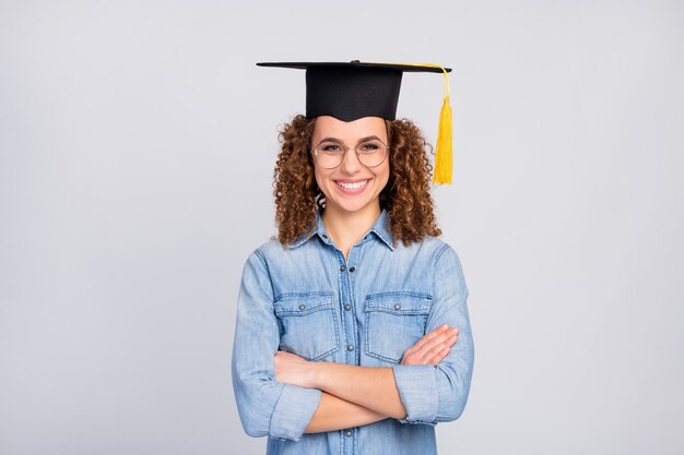 woman with trendy hairstyle and graduate hat