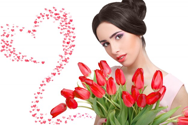 Donna con bouquet di tulipani