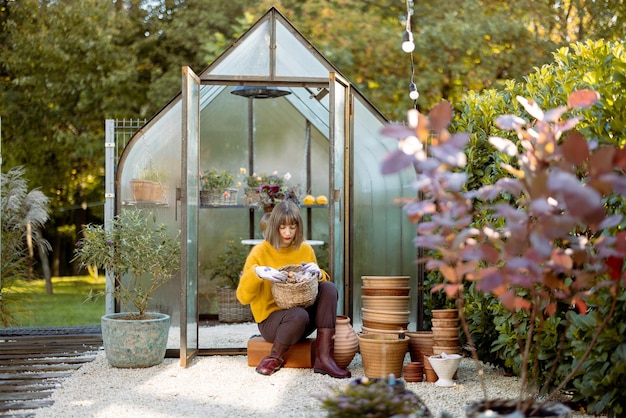 Woman with tulip bulbs in garden