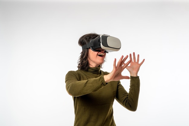 Woman with virtual reality glasses on a white background copy space