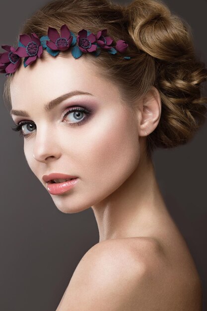 A woman with a wreath of flowers on her head