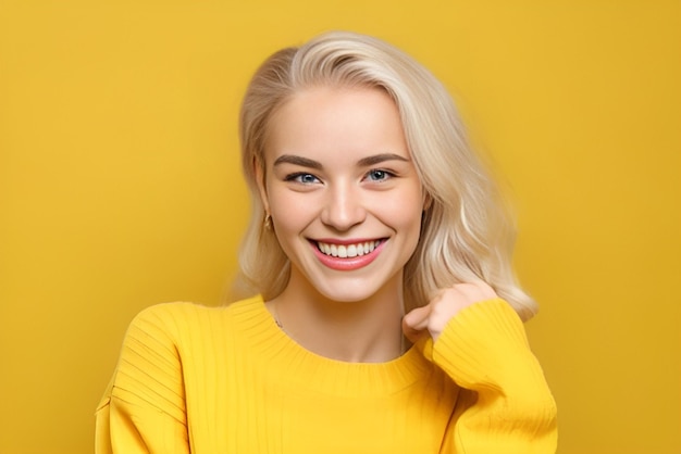 A woman with a yellow sweater smiles