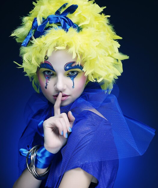 Woman with yellow wig feather