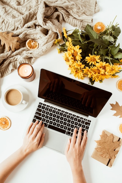 Woman work on laptop. Decorated home office table desk workspace. Flat lay, top view