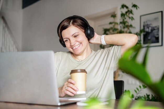 Woman work on laptop at the table