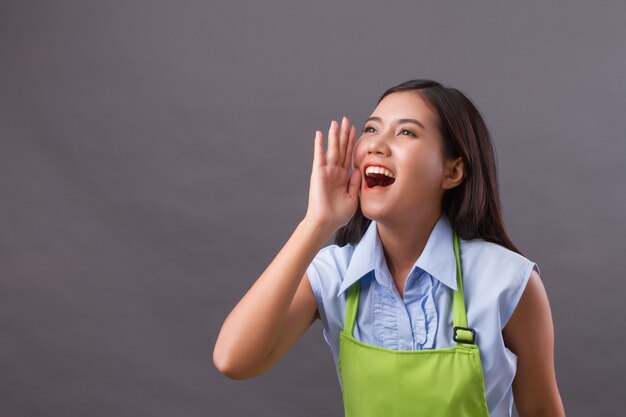 Woman worker shouting, speaking, communicating, announcing