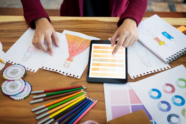 Woman working as fashion designer choosing colour